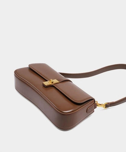 Éloise | Sleek Leather Baguette Bag – Detachable Strap & Gold-Tone Lock