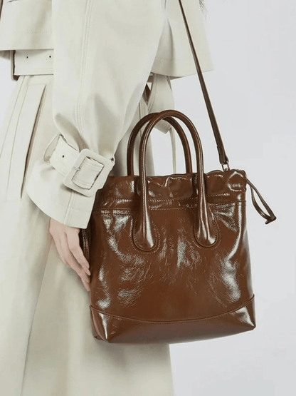 Maelora | Glossy Black Leather Drawstring Bag – Chic & Modern