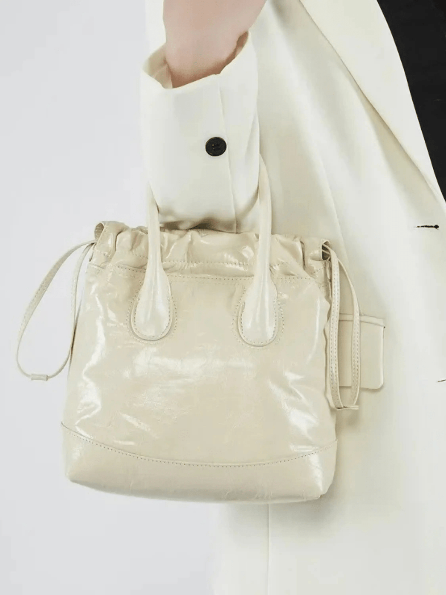 Maelora | Glossy Black Leather Drawstring Bag – Chic & Modern
