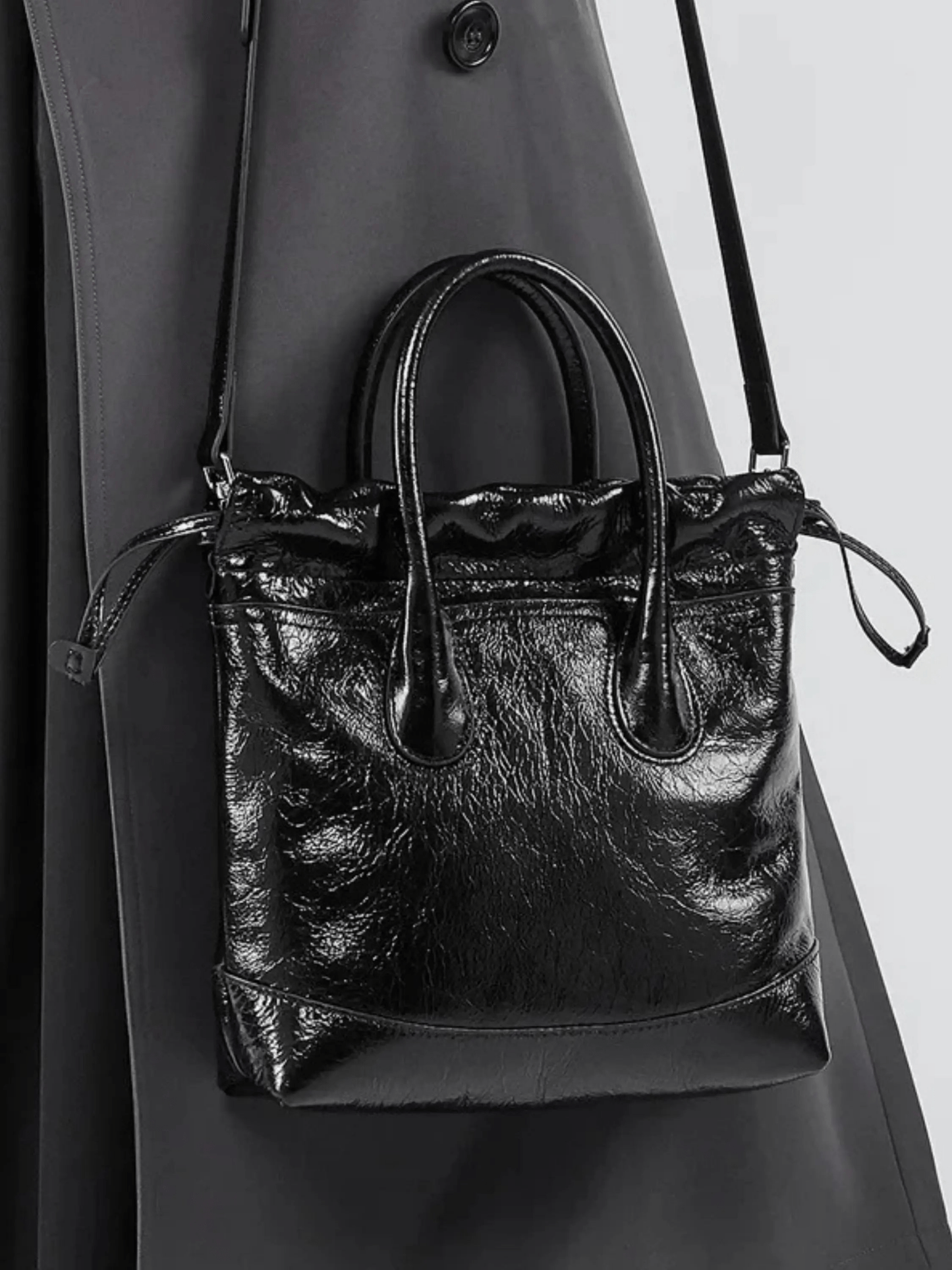 Maelora | Glossy Black Leather Drawstring Bag – Chic & Modern