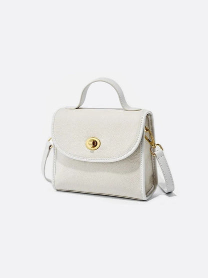 Aurora Signature Trapeze Bag – Structured Handbag with Turn-Lock Closure