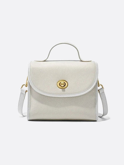 Aurora Signature Trapeze Bag – Structured Handbag with Turn-Lock Closure